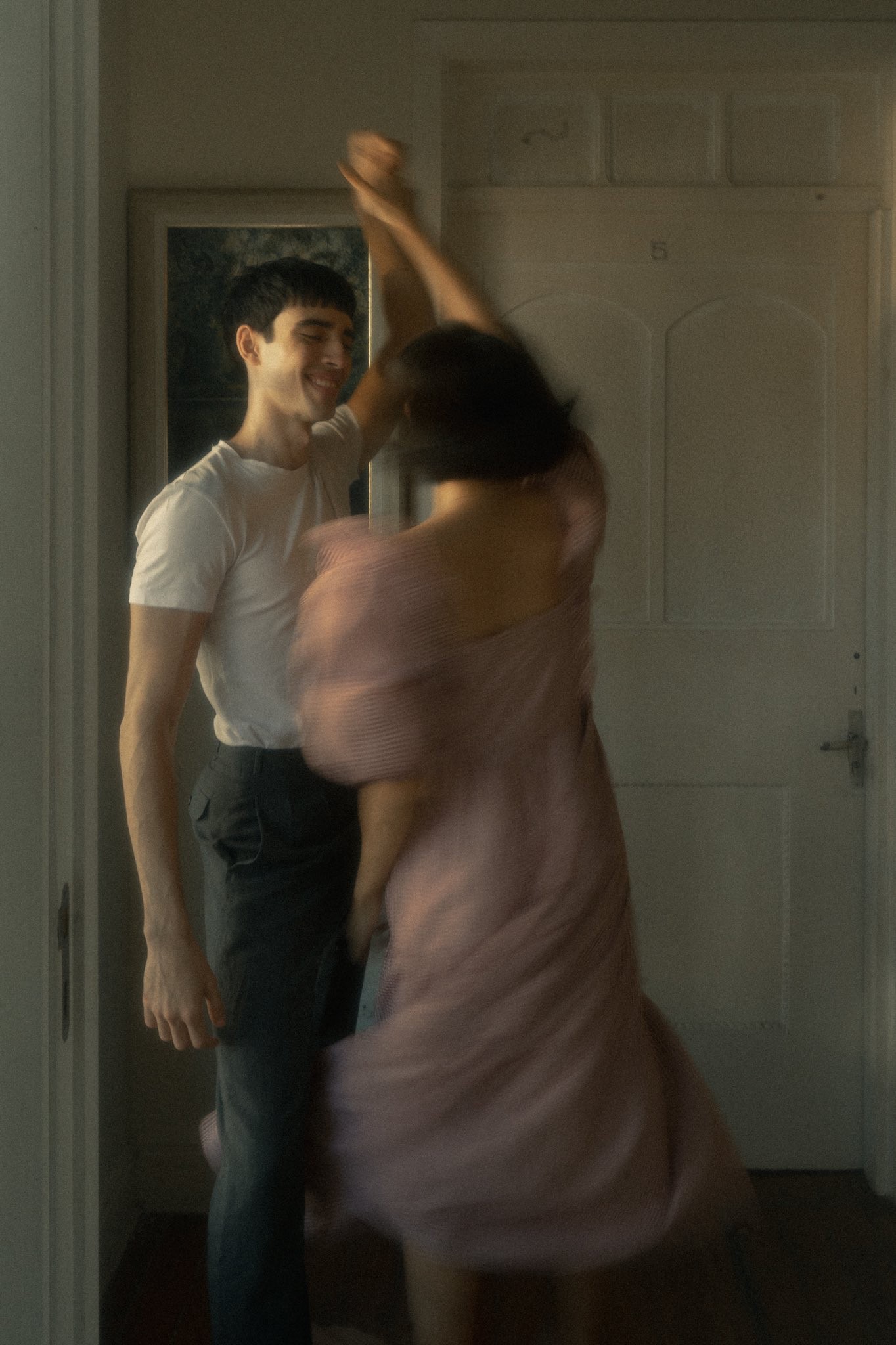 couple dancing inside a room