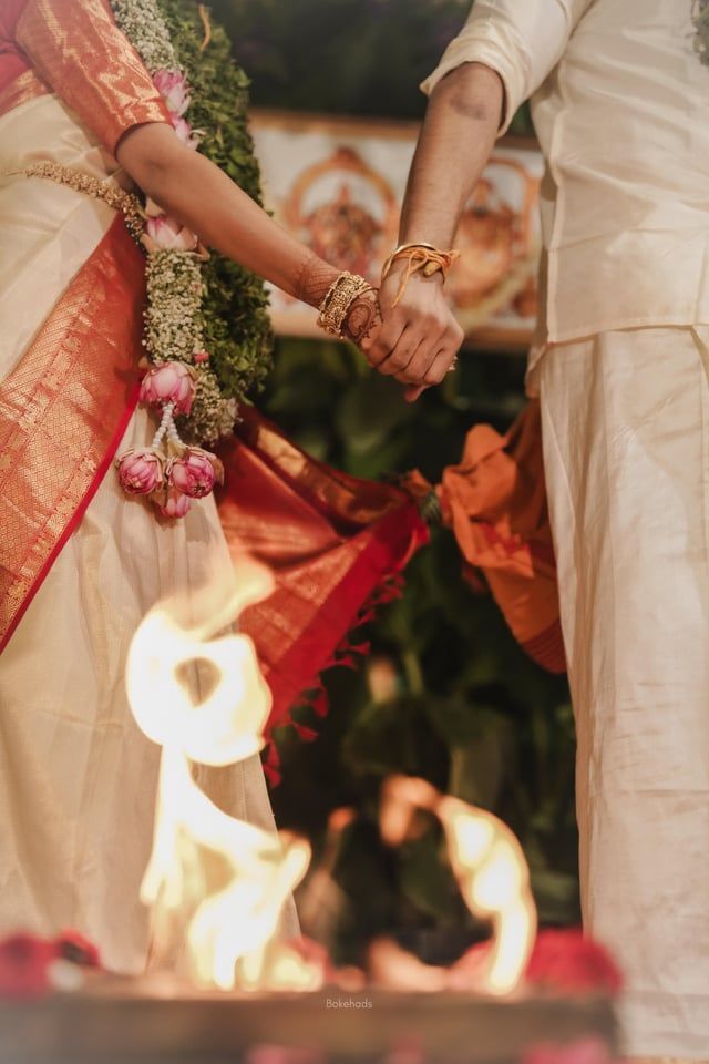 Indian Hindu couple taking pheras in front of the fire